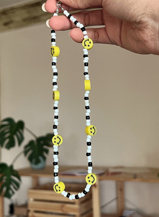 The smiley face phone strap