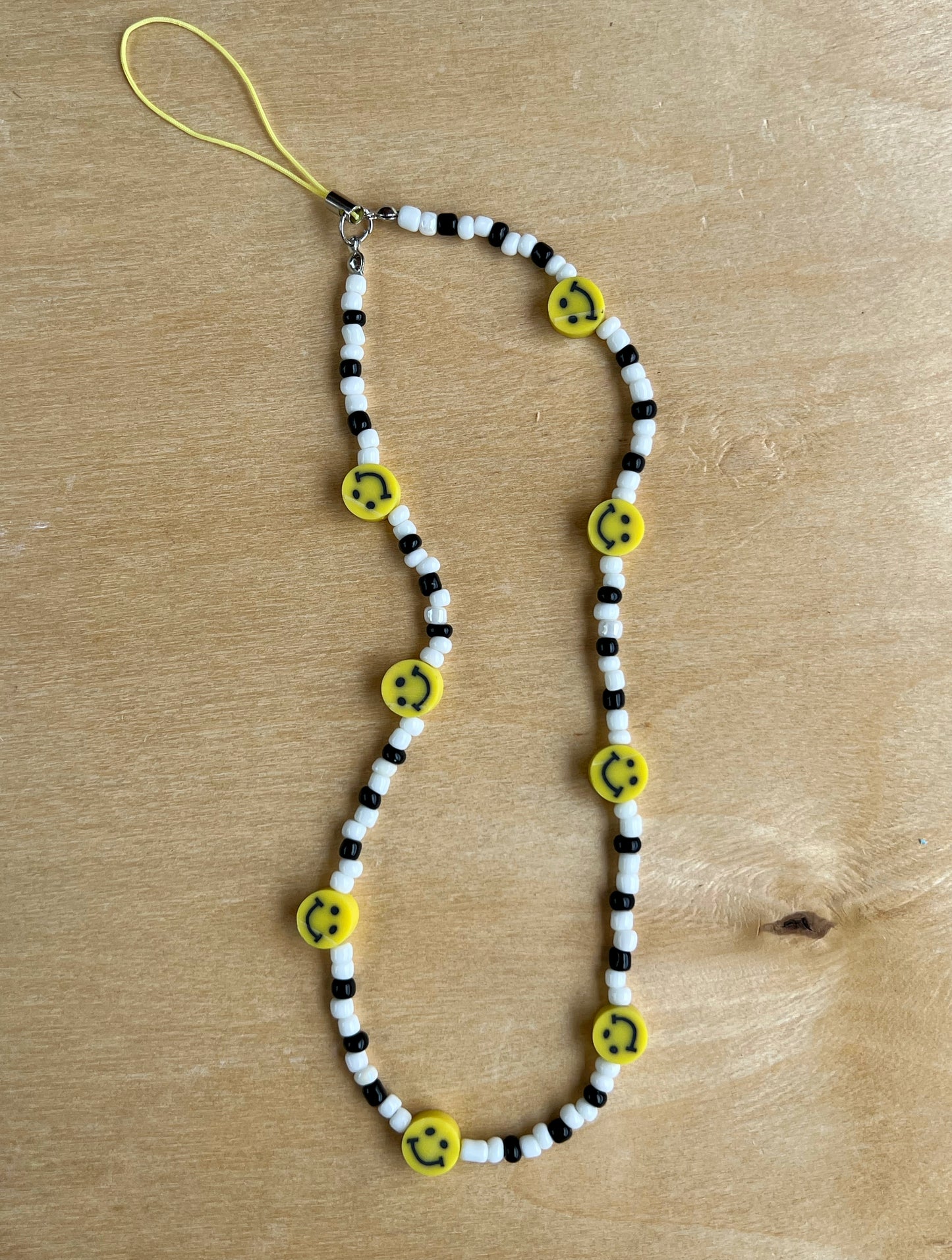 The smiley face phone strap